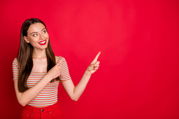 Photo of pretty lady hands indicating empty space wear casual outfit isolated burgundy background