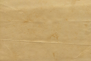 Vintage and old looking paper background. Retro cardboard texture. Grunge paper for drawing. Ancient book page.