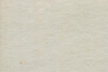 Vintage and old looking paper background. Retro cardboard texture. Grunge paper for drawing. Ancient book page.