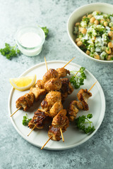 Homemade chicken skewers with fresh parsley