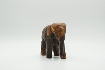 Wooden figure of elephant on white background