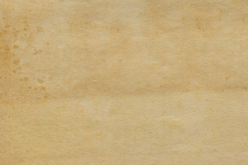 Vintage and old looking paper background. Retro cardboard texture. Grunge paper for drawing. Ancient book page.