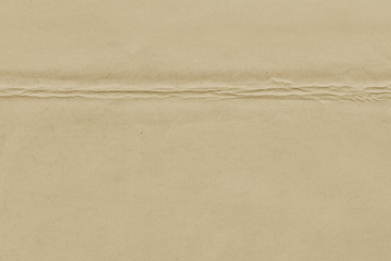 Vintage and old looking paper background. Retro cardboard texture. Grunge paper for drawing. Ancient book page.