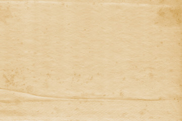 Vintage and old looking paper background. Retro cardboard texture. Grunge paper for drawing. Ancient book page.
