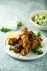 Homemade chicken skewers with fresh parsley