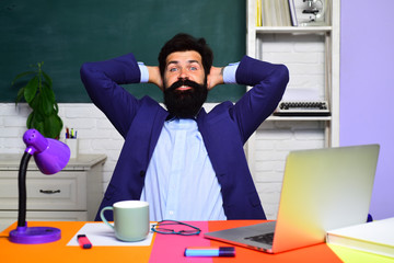 Teacher. Education, knowledge concept. Coffee break. Back to school. Student thinking about coursework. Surprised male student in auditorium. Educational process. Male student learning in classroom.