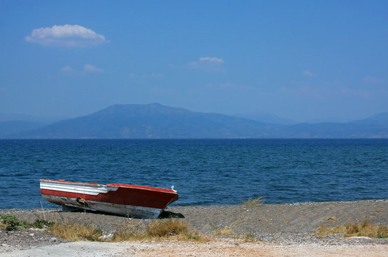 Lone row boat at the coast in Greece