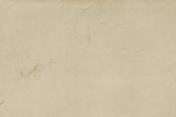 Vintage and old looking paper background. Retro cardboard texture. Grunge paper for drawing. Ancient book page.