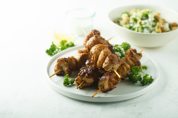 Homemade chicken skewers with fresh parsley