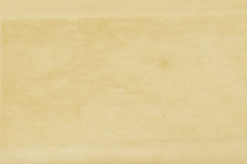 Vintage and old looking paper background. Retro cardboard texture. Grunge paper for drawing. Ancient book page.