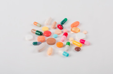 High number of pills on white background surface. High resolution image for pharmaceutical industry.