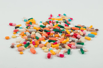 High number of pills on white background surface. High resolution image for pharmaceutical industry.