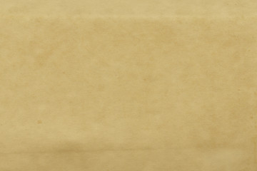 Vintage and old looking paper background. Retro cardboard texture. Grunge paper for drawing. Ancient book page.