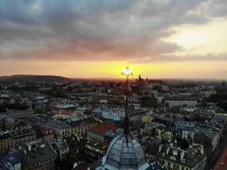Naklejka premium Aerial photo from drone. The culture and historical capital of Poland. Comfortable and beautiful Krakow. The land of Legend. Beautiful Sunset,old part of city.
