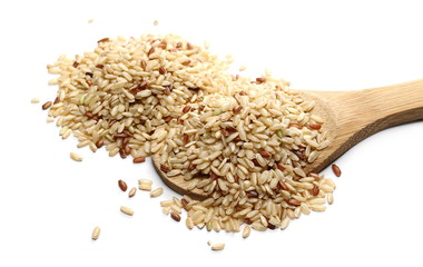 Integral rice pile with wooden spoon isolated on white background