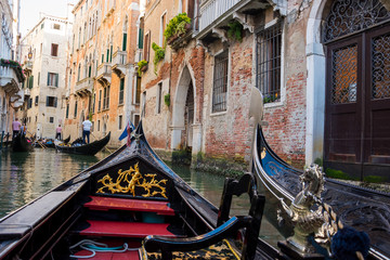 View of the Canal from a gondola in Venice, Italy. The part of the gondolas of the Venice background