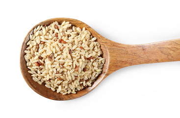 Integral rice pile with wooden spoon isolated on white background, top view