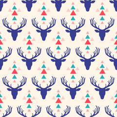 Seamless pattern with deer head and triangles. Tribal vector pattern.