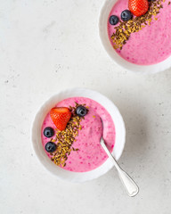 Smoothie bowl with fresh berries, golden and brown flax seeds. Healthy breakfast, fitness, diet concept.