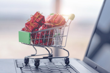 Shopping cart and laptop computer with gift boxes