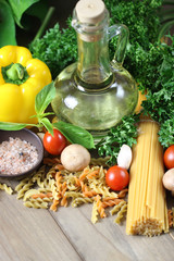 Spaghetti ingredients on wooden, Italian food background.