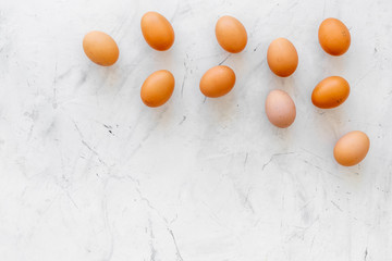 Blog pattern with eggs on marble background top view copyspace
