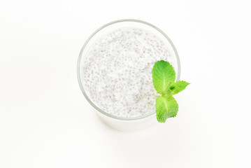 Obraz na płótnie Canvas Chia pudding with mint on a white background. Space for text or design.