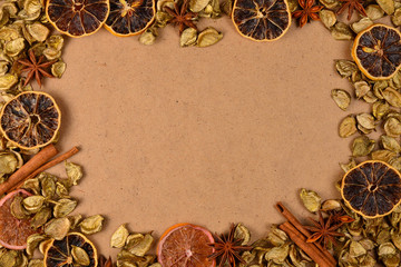 Autumn background with golden leaves, dried fruts, cinnamon and anis. Space for text or design.