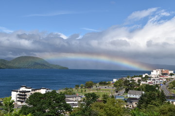 Fototapeta na wymiar Landscape with Lake Toya and rainbow in Toya, Hokkaido, Japan