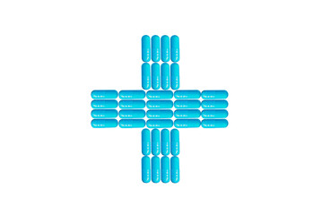 Blue capsules, pills in the shape of a cross, ambulance sign isolated on white background, medicine concept