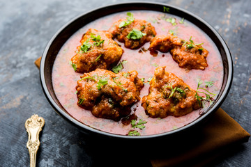 Lauki Kofta Curry made using Bottel Gourd or Doodhi, served in a bowl or karahi. selective focus