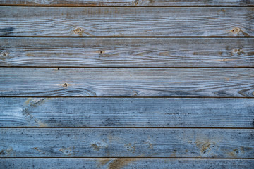 closeup rustic wooden desk wall. background with nice texture with blue, red and orange colours