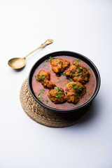 Lauki Kofta Curry made using Bottel Gourd or Doodhi, served in a bowl or karahi. selective focus