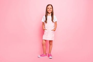 Obraz premium Full body photo of little lady brown hair holidays leisure time hands pockets wear rose sun dress t-shirt isolated pink background