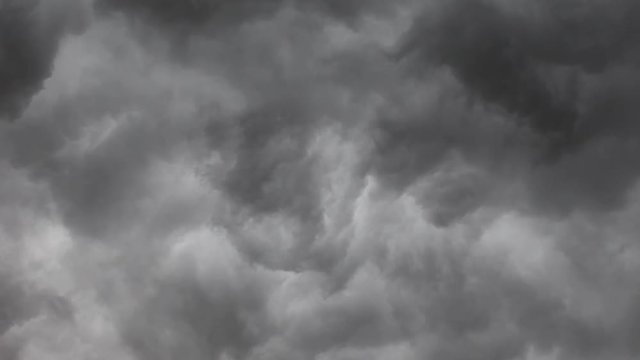 4k timelapse of dark thunderstorm cloud overcasting the moody sky for background design purpose