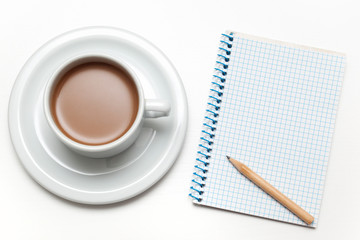 Notebook and cup of coffee on white background