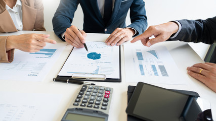 Business People Talking Discussing with coworker planning analyzing financial document data charts and graphs in Meeting and  successful teamwork Concept.