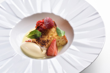 Fine dining dessert, Souffle, Raspberry Parfait, ice cream, white chocolate mousse and spices