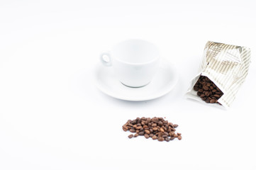 Coffee beans and cup isolated on white background.Copy space