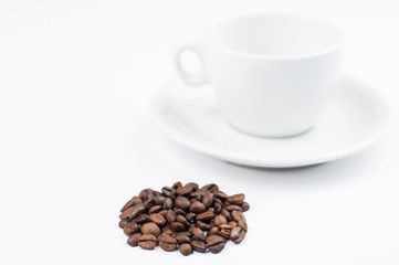 Coffee beans and cup isolated on white background.Copy space