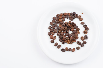 Coffee beans and cup isolated on white background.Copy space