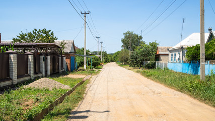 Fototapeta na wymiar panoramic view of dirty road in Akhtyrka village