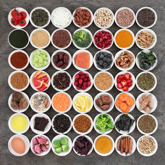 Large health food selection to slow the ageing process including fish, fruit, vegetables, seeds, nuts, herbs, spices, supplement powders, honey, dairy, pollen grain, green teas, and dark chocolate.  