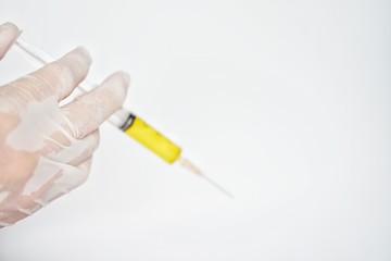 Close up doctor holding medical injection on white background	