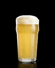 glass of beer on a black background