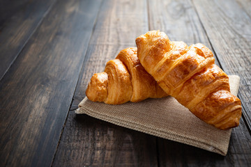 croissants on old wooden table.