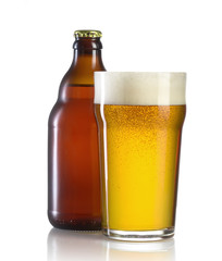 glass of beer and bottle on white background