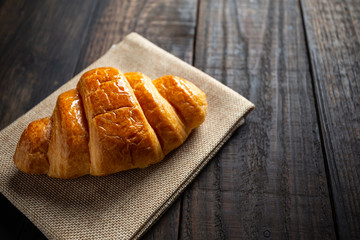 croissants on old wooden table.