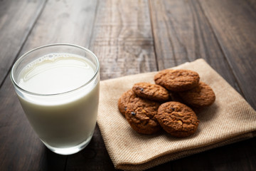 cookies and Glass milk on wooden table.
