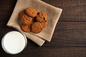 cookies and Glass milk on wooden table.